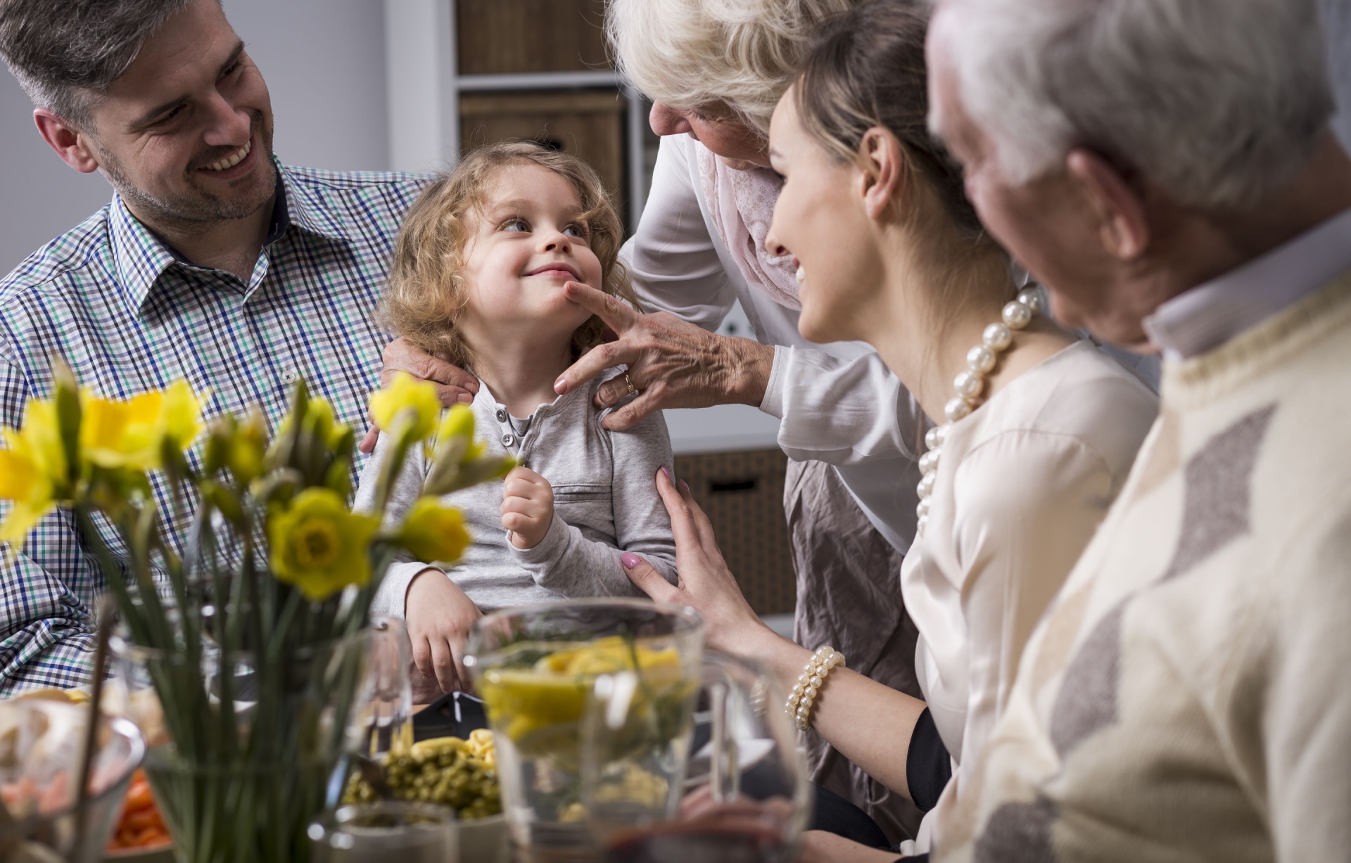 Multi-generation family having dinner together.