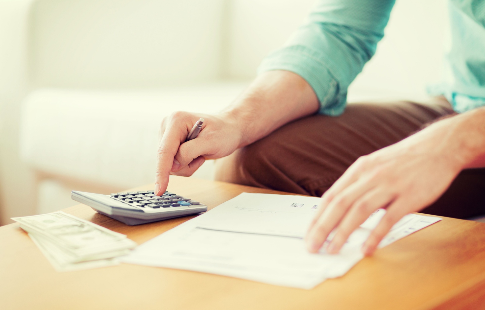 A man using a calculator.