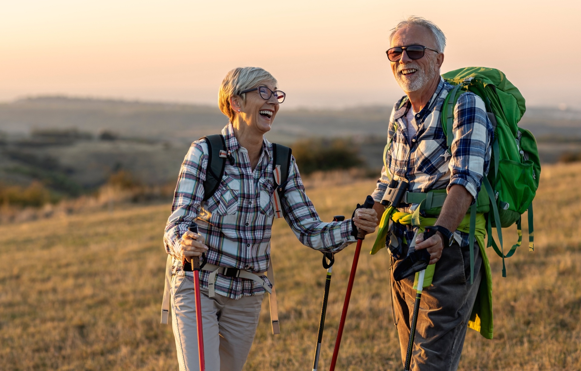 A retired couple hiking.