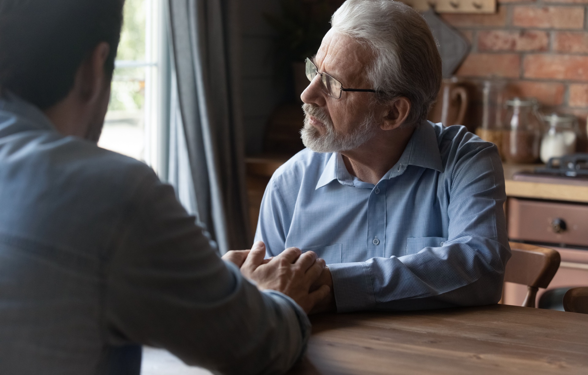 A father talking to his adult son.