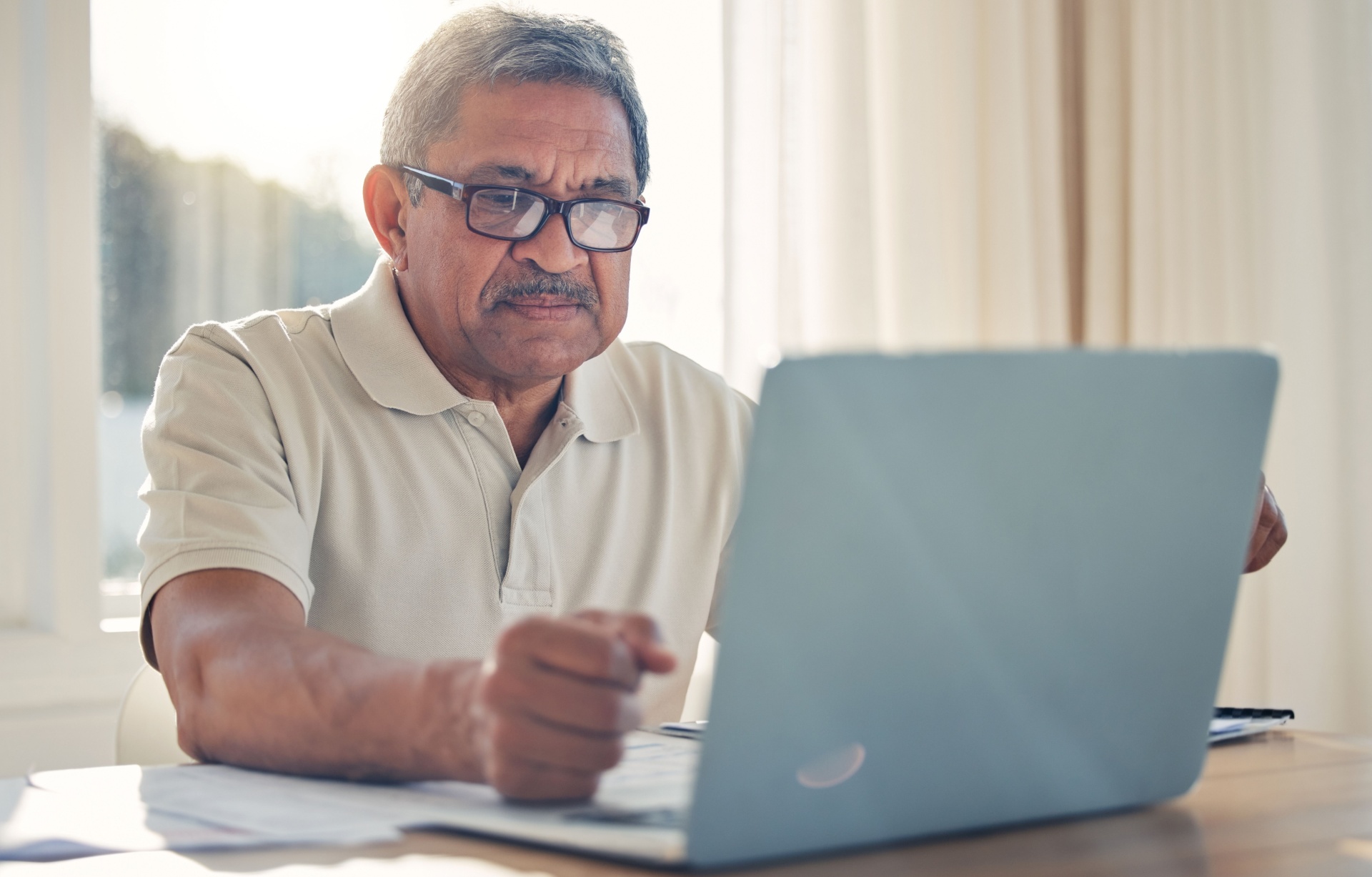 A man using a laptop.