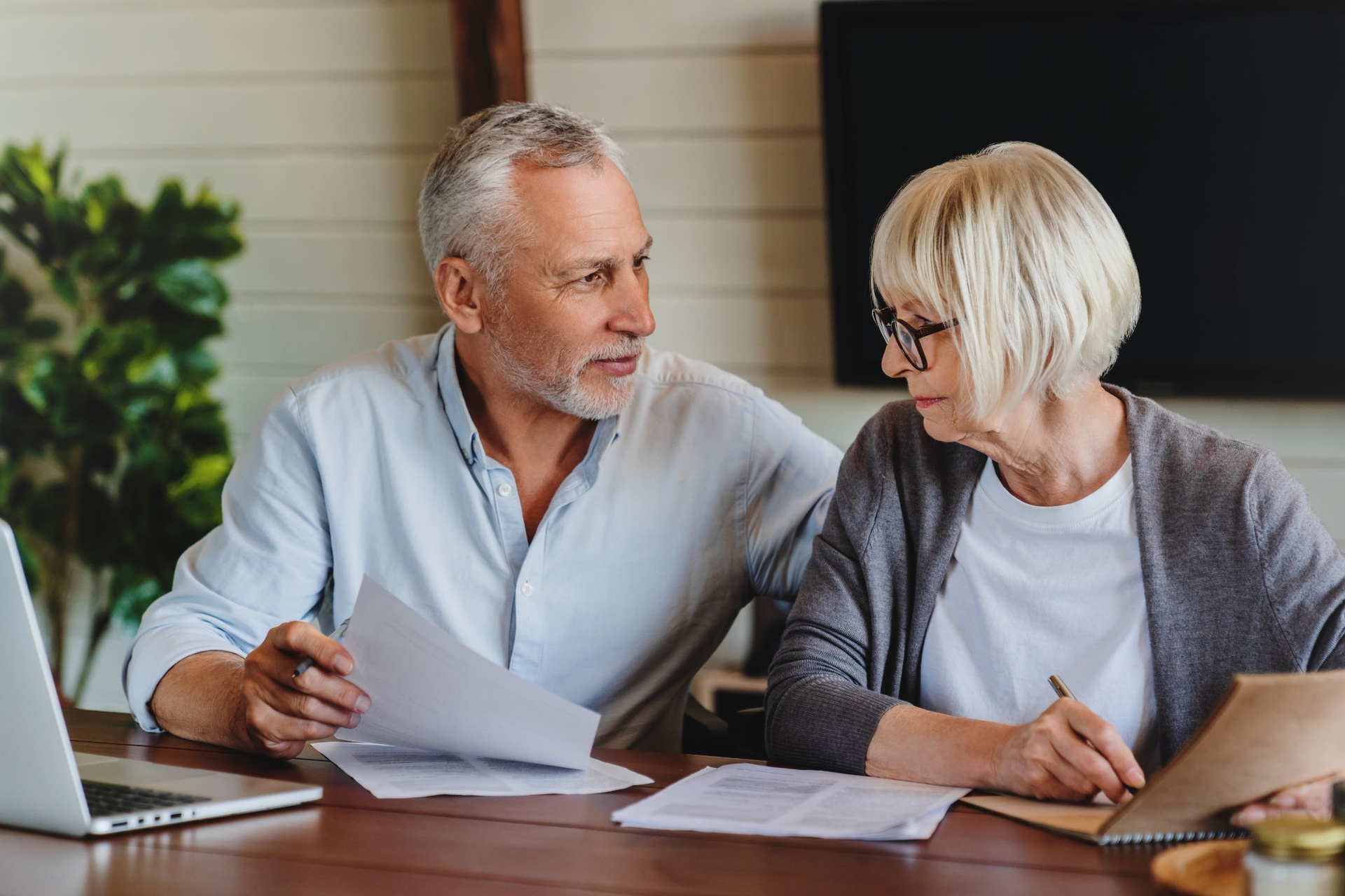 A couple reviewing paperwork together.